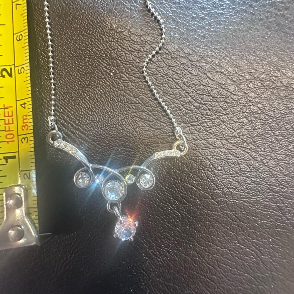 Elegant Silver Necklace with Sparkling Stones with earrings